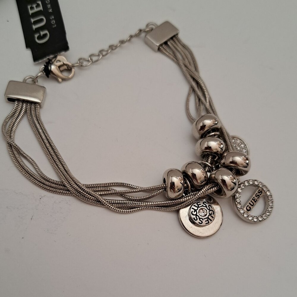 Guess women's silver tone charm bracelet